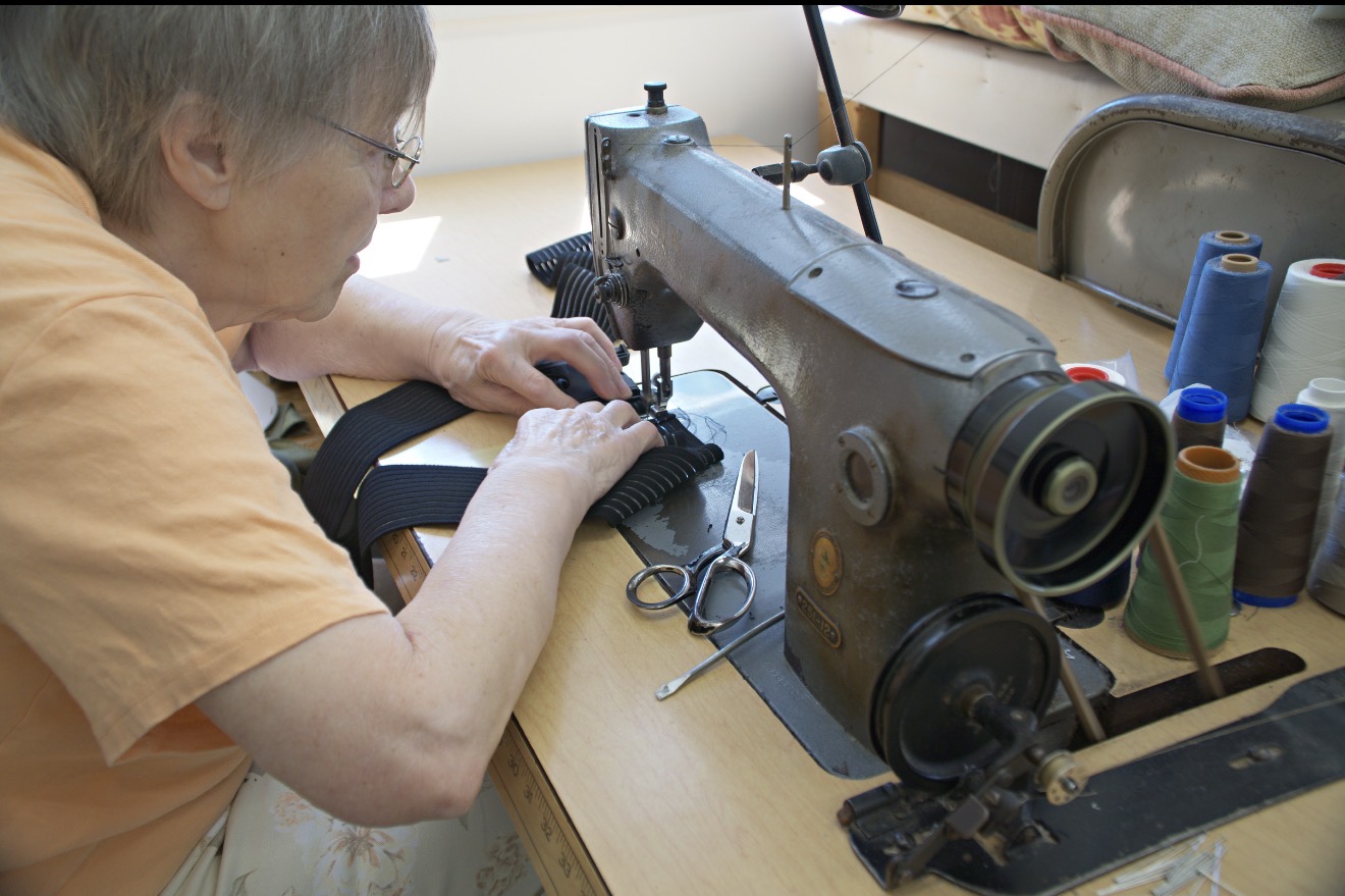 Erika Pasterak sewing SwiftClick band material at her machine